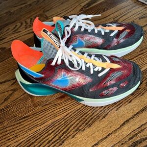 Nike N110 D/MS/X sneaker in the Black/Blue Gaze/University Red/Blue Hero